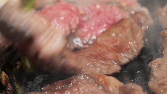 Juicy meat sizzling on a hot grill