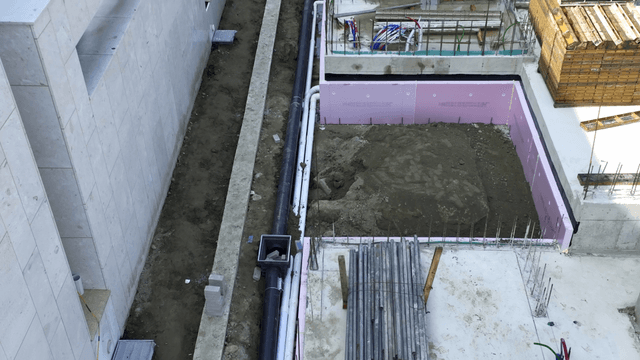 Construction site with materials and pipes