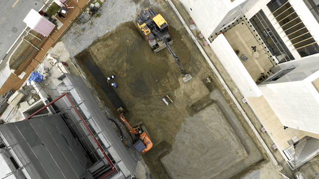 Construction site with excavator in action