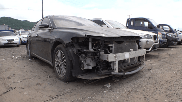 Car with damaged front parked in lot
