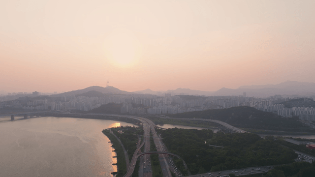 Busy Seoul road with bridge over the Han River
