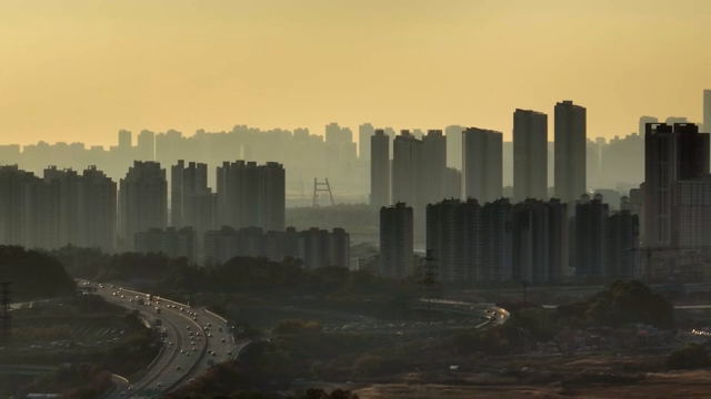 City skyline with highway at sunset