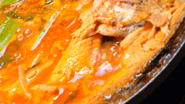 Spicy trout stew boiling with vegetables