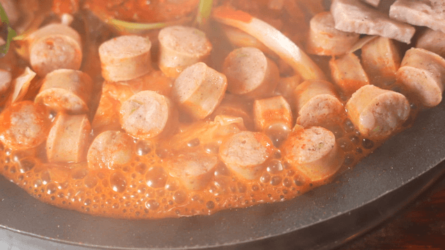 Spicy budaejjigae boiling hot in pot