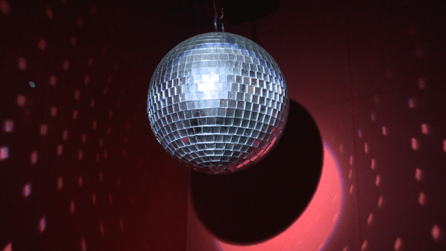 Disco ball reflecting light on stage
