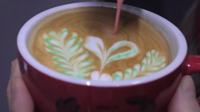 Creating latte art with colorful milk