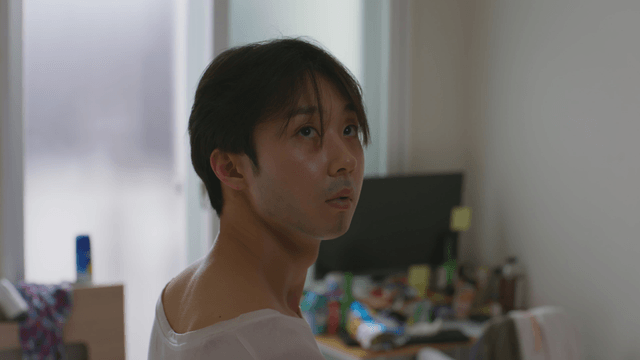 Man in a room looking around