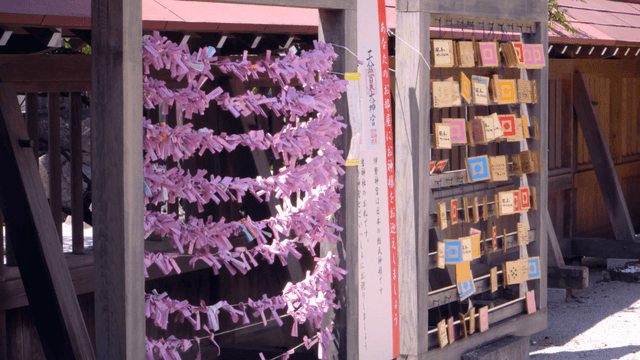 Wooden plaques and paper strips at Japanese shrine