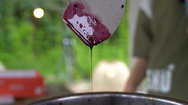 Stirring a pot of berry sauce
