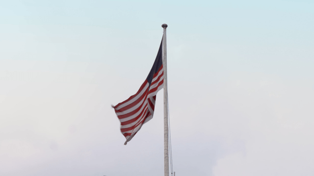 Malaysia national flag waving on a tall flagpole