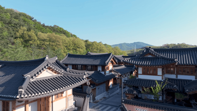 Traditional hanok village with view of mountain hill