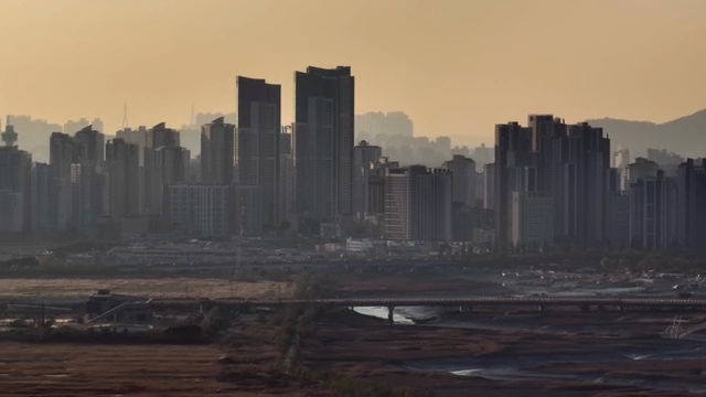 City skyline with tall buildings at dusk