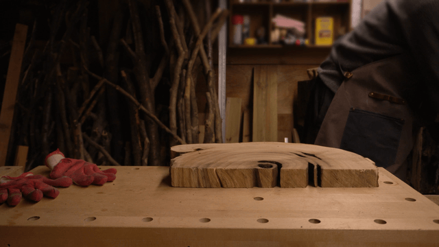 Woodcraft artisan organizing a cozy woodworking workshop