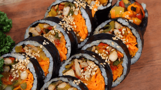 Carrot gimbap sprinkled with sesame seeds