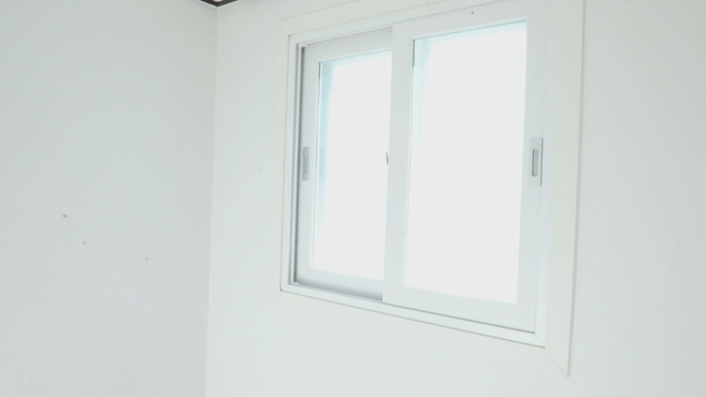 Empty room with wooden floor and window