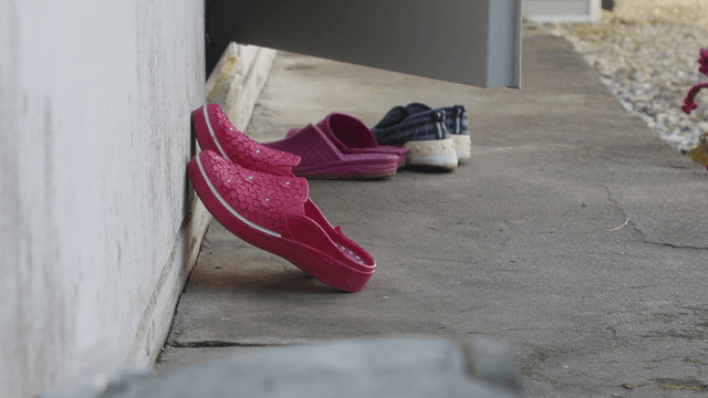 Colorful slippers outside a door