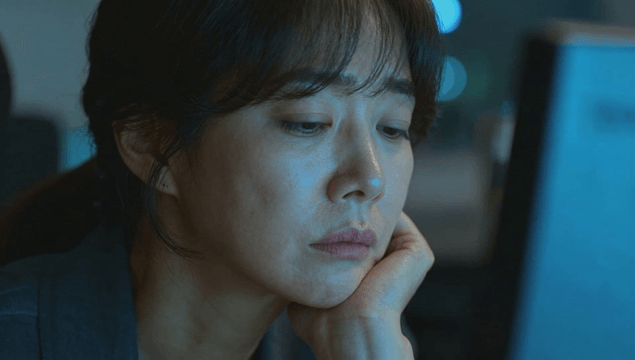 Woman working late at a desk