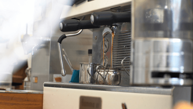Coffee being extracted from espresso machine