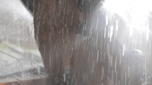 Stone cutter spraying water