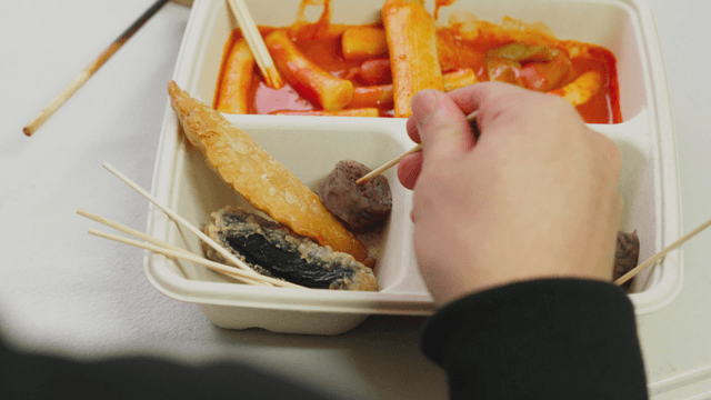 Person eating sundae on a skewer