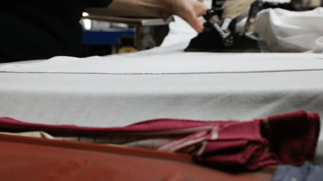 Ironing clothes on a table indoors
