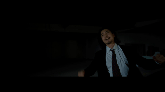 Nighttime martial arts scene with two men