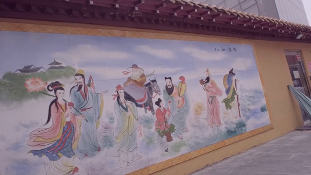 A mural depicting traditional figures