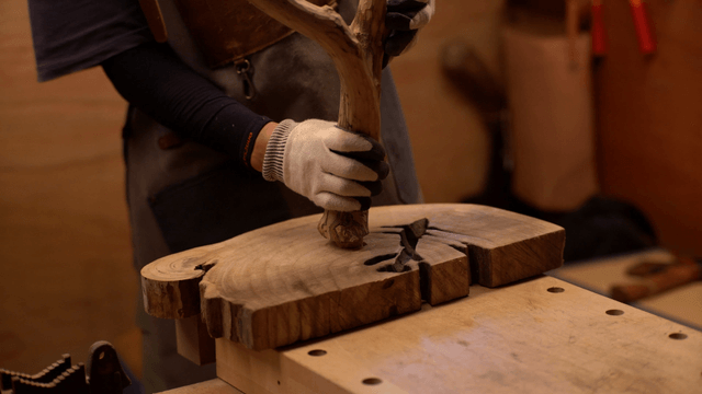 Craftsman working with wood in a workshop
