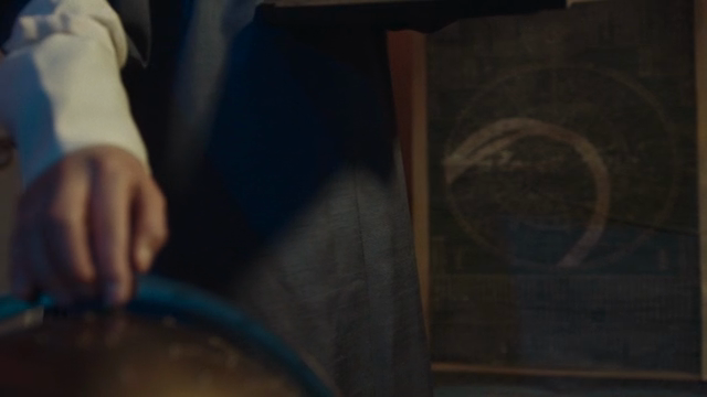 A person examining an ancient map