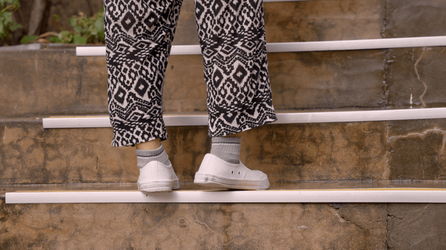 Person walking up outdoor stairs