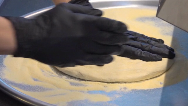 Preparing dough on a tray with flour