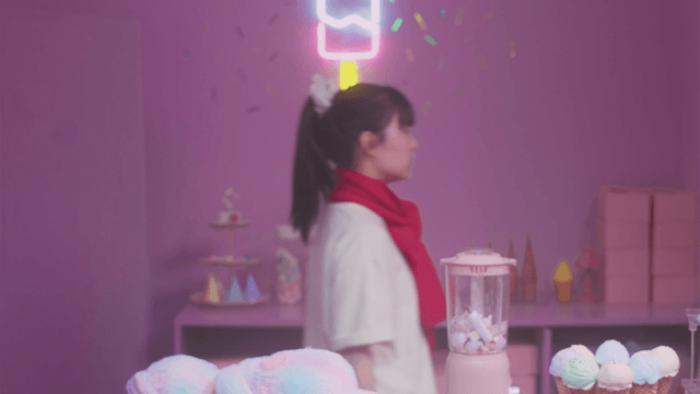Girl in a colorful ice cream shop