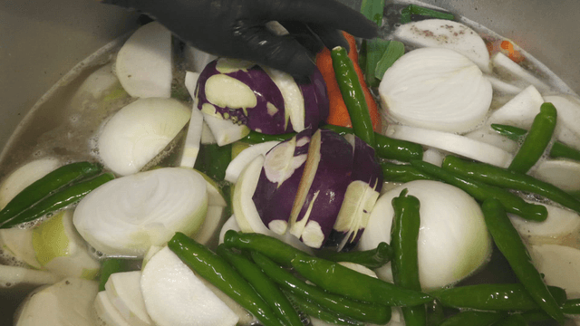 Vegetables boiling in a large pot