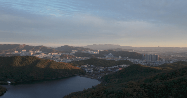 City surrounded by mountains at evening