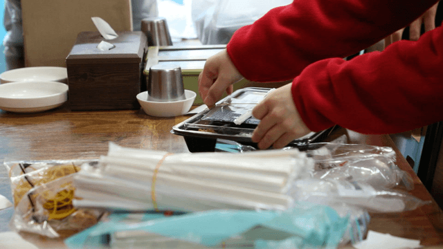 Preparing takeout meals on a table