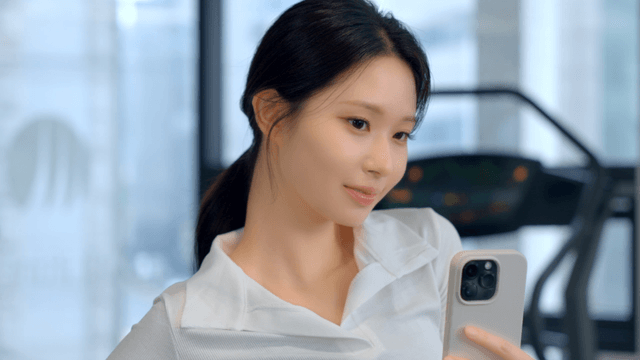 Young woman taking a selfie at the gym
