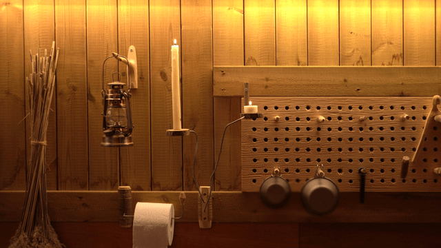 Warmly lit wooden wall with decorations