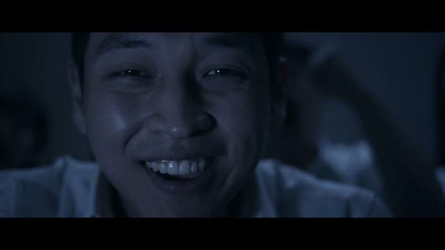 Men rejoicing in dark room