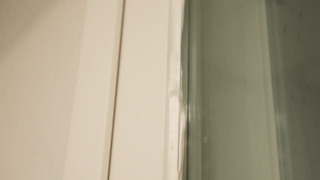 Uneven sealant applied along window frame