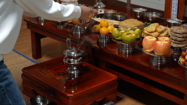 Traditional holiday ritual offering with bowing person