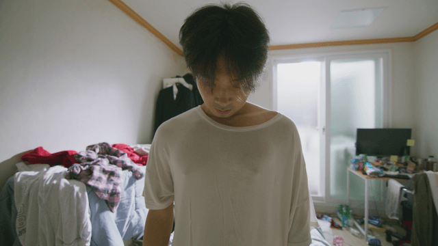 Tired person in a messy room