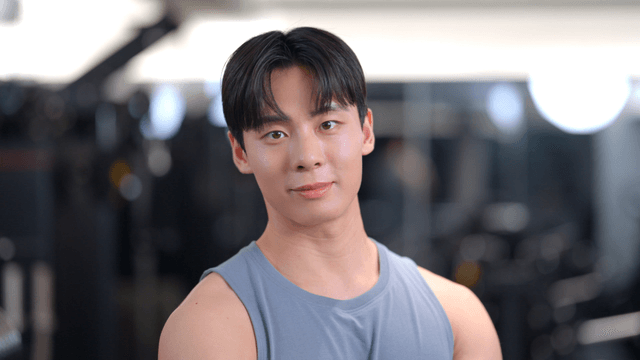 Young man posing confidently at gym