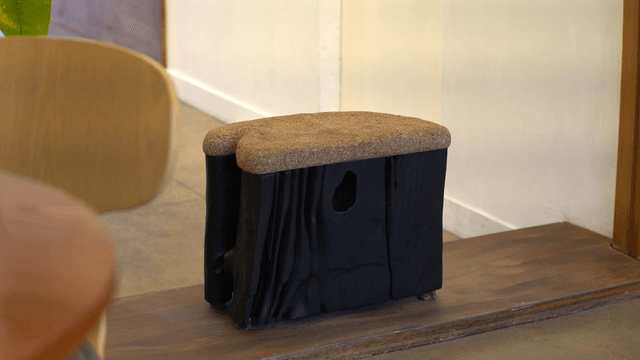 Unique wooden chair in a cozy indoor space