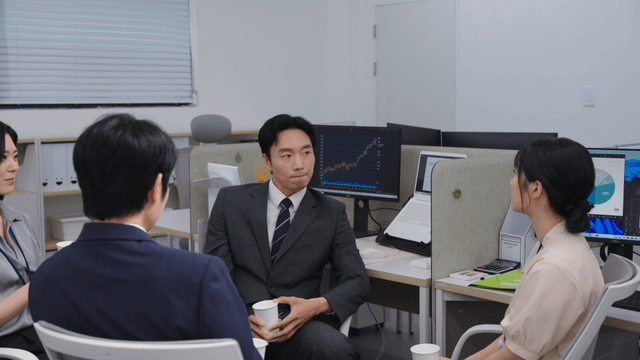 Office meeting with colleagues discussing