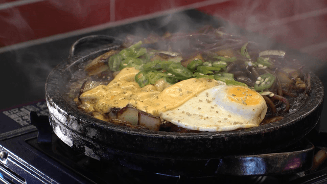 Boiling cheese jajang noodles on gas stove griddle