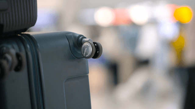 Suitcase wheel in a busy airport