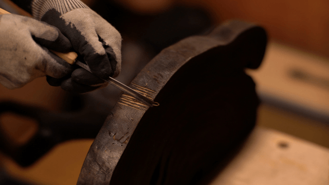Craftsman carving wood with precision