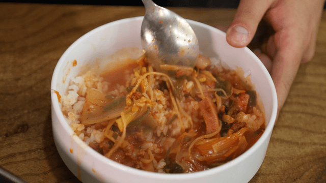 Budaejjigae mixed with rice in a bowl