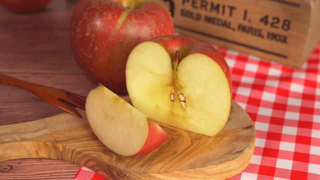 Sliced apple on a wooden board