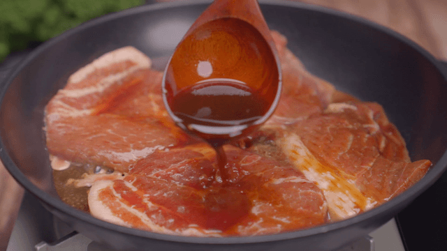 Marinated pork cooking in a pan